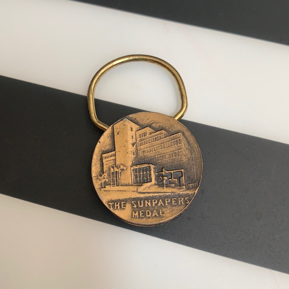 The Sunpapers Medal Keychain